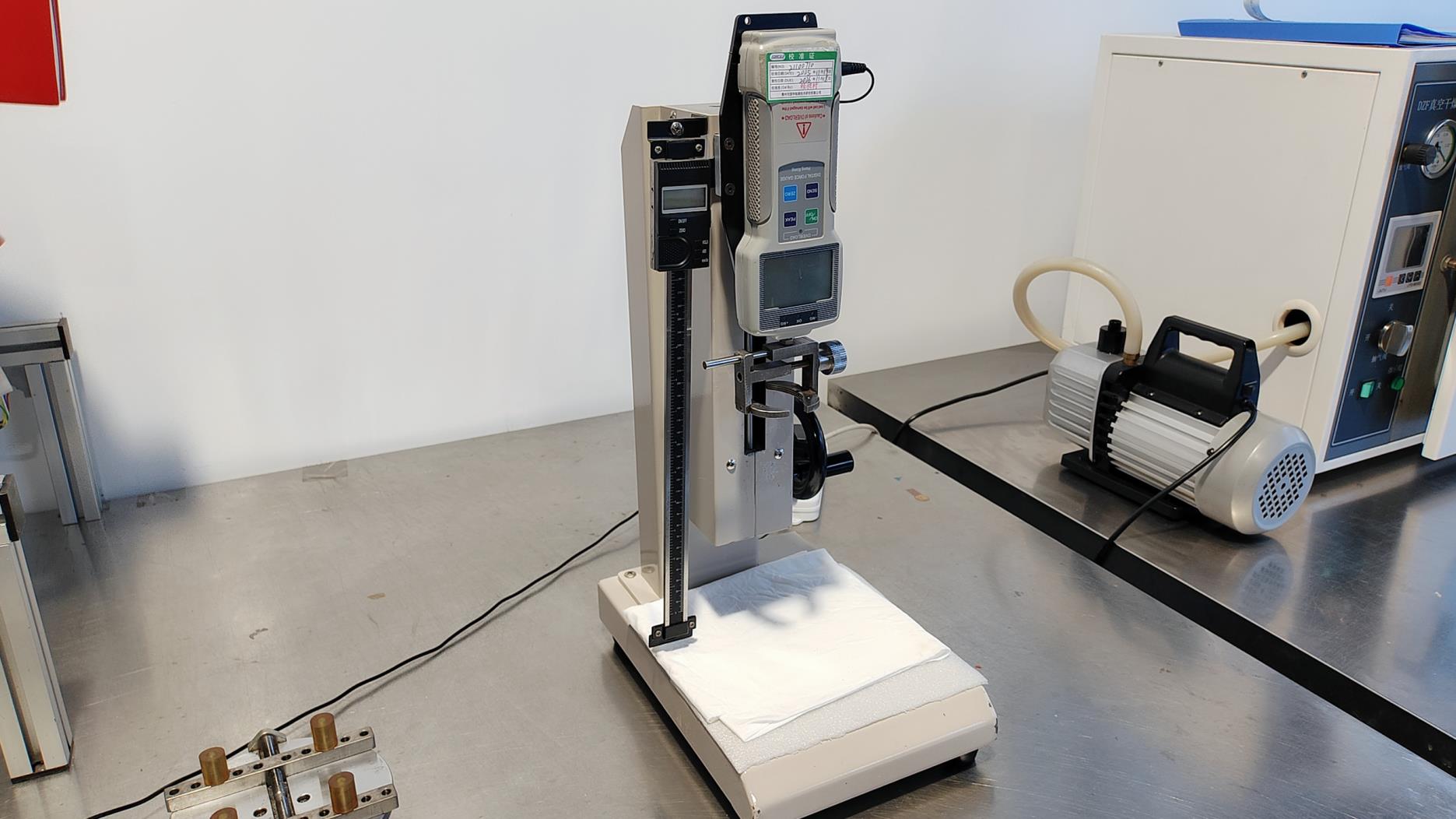 Tensile tester for paperboard strength